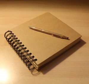 notebook with pen